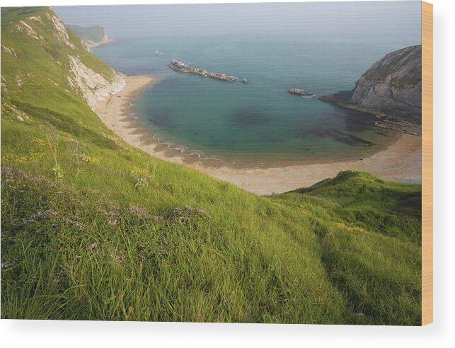 Water's Edge Wood Print featuring the photograph Man Of War Bay In Dorset, England by Davidcallan