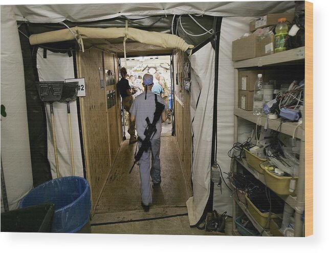 Rifle Wood Print featuring the photograph Medical Personnel At Balad Trauma by Chris Hondros
