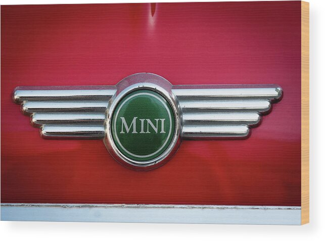 Mini Wood Print featuring the photograph Mini Cooper car logo on red surface by Michalakis Ppalis