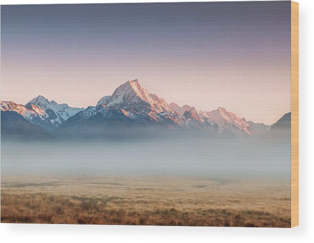 Tranquility Wood Print featuring the photograph Mt Cook Emerging From Mist At Dawn, New by Matteo Colombo