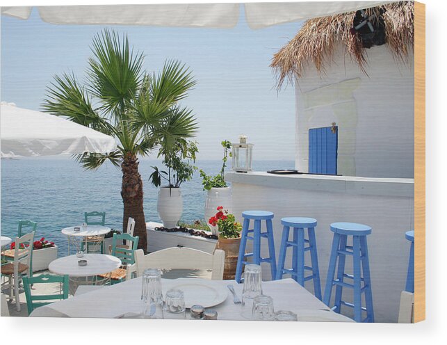 Greek Culture Wood Print featuring the photograph Open Air Restaurant By The Sea In by Alanphillips