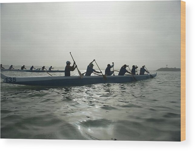 Sport Rowing Wood Print featuring the photograph Outrigger Canoeing Team Compete by Moodboard