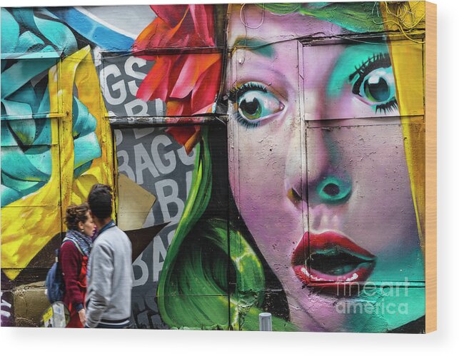 Art Wood Print featuring the photograph People Walking Past Graffiti Face by Tim Bird