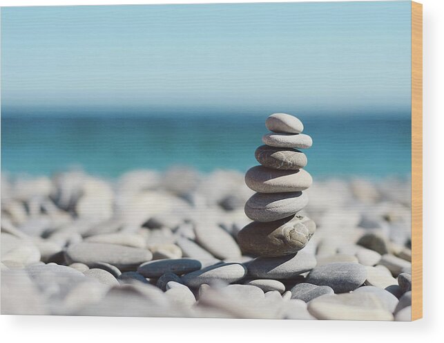 French Riviera Wood Print featuring the photograph Pile Of Stones On Beach by Dhmig Photography