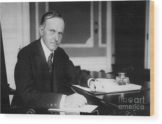 Calvin Coolidge - Us President Wood Print featuring the photograph President Calvin Coolidge At Desk by Bettmann