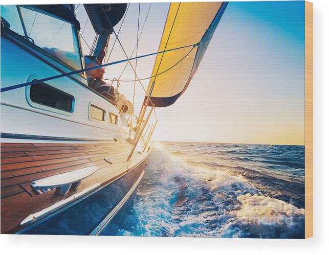 Small Wood Print featuring the photograph Sailing Into The Sunset by Epicstockmedia