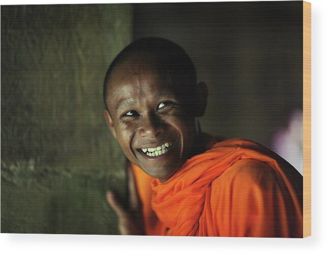 Orange Color Wood Print featuring the photograph Smiling Buddhist Monk At Angkor Wat by Timothy Allen Orange Color Wood Print featuring the photograph Smiling Buddhist Monk At Angkor Wat by Timothy Allen