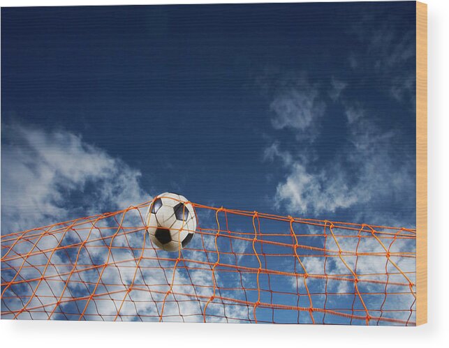 Working Wood Print featuring the photograph Soccer Ball Going Into Goal Net by Fuse