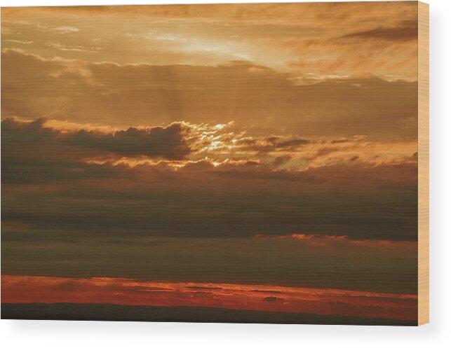 Sunset Wood Print featuring the photograph Sun behind dark clouds in Vogelsberg by Sun Travels