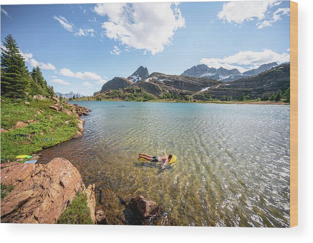 Floating Wood Print featuring the photograph Swimming In Limestone Lakes Height Of The Rockies Provincial Park by Cavan Images