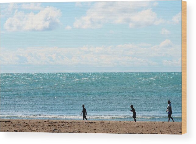 Young Men Wood Print featuring the photograph Three People Walking By Coast Line by J.castro