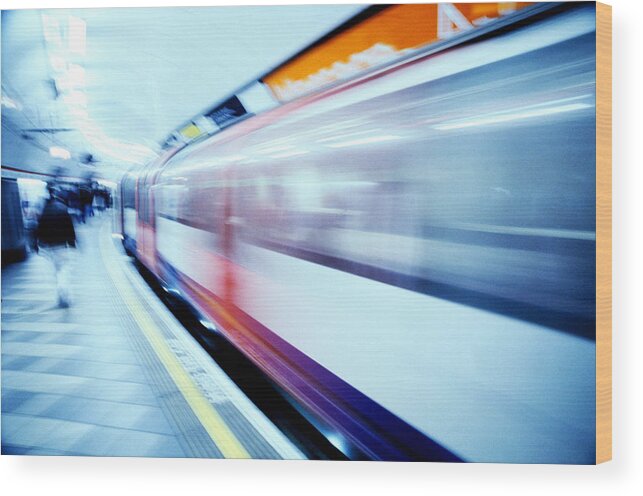 People Wood Print featuring the photograph Train Moving At High Speed Past A by Stockbyte