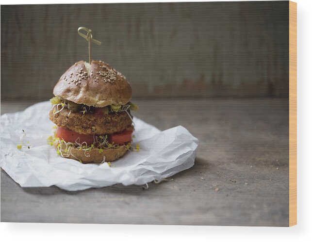 Ip_12433687 Wood Print featuring the photograph Vegan Millet Burger With Broccoli Sprouts On A Lye Bread Roll by Kati Neudert