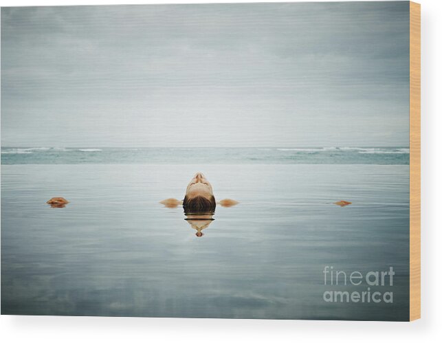 People Wood Print featuring the photograph Woman Floating On Back In Infinity Pool by Thomas Barwick