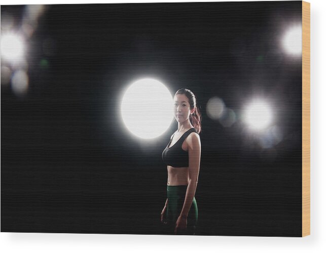 Three Quarter Length Wood Print featuring the photograph Young Woman Exercising by Runphoto