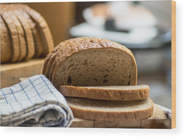 Cutting Board Wood Print featuring the photograph Fresh brown bread #1 by Stanzi11