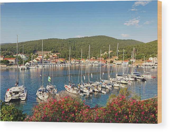 Fiscardo Wood Print featuring the photograph The port of Fiskardo in Kefalonia, Greece #1 by Constantinos Iliopoulos