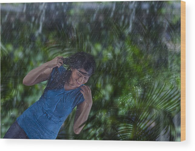 Three Quarter Length Wood Print featuring the photograph Woman enjoying in the rain #1 by Abhinandita Mathur 