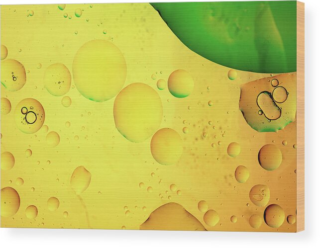 Fluid Wood Print featuring the photograph Abstract, image of oil, water and soap with colourful background by Michalakis Ppalis