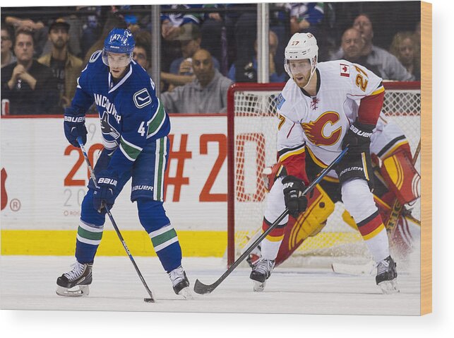 People Wood Print featuring the photograph Calgary Flames v Vancouver Canucks #27 by Rich Lam