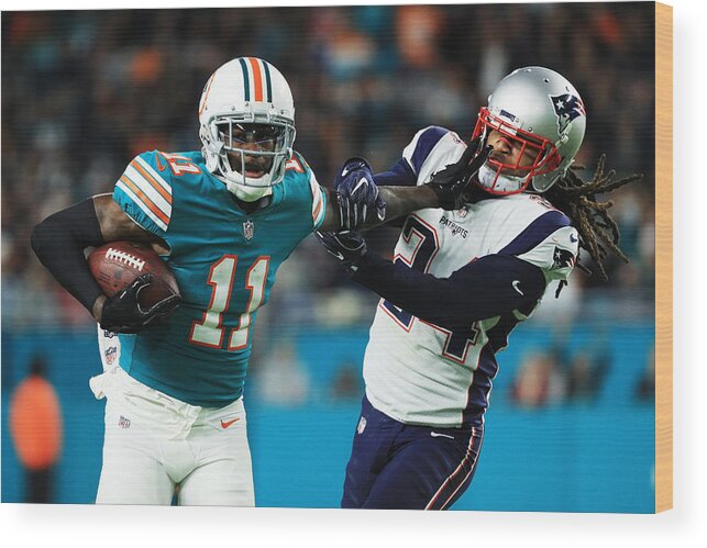 Miami Gardens Wood Print featuring the photograph New England Patriots v Miami Dolphins #5 by Mike Ehrmann