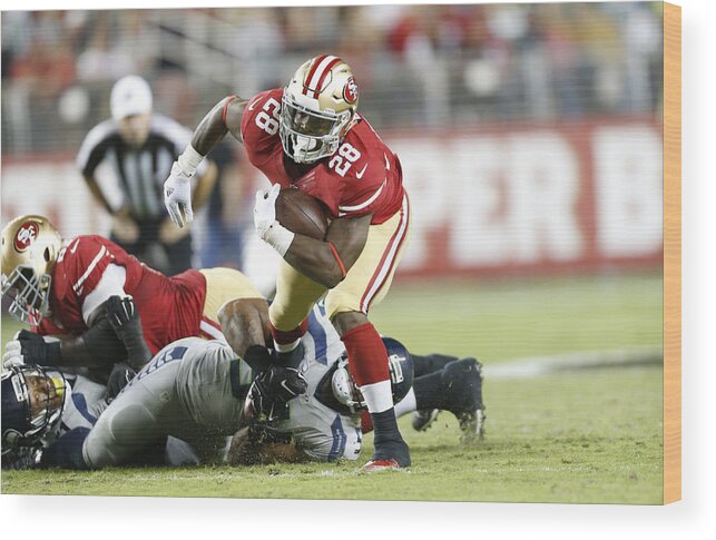 Carlos Hyde Wood Print featuring the photograph Seattle Seahawks v San Francisco 49ers #63 by Michael Zagaris
