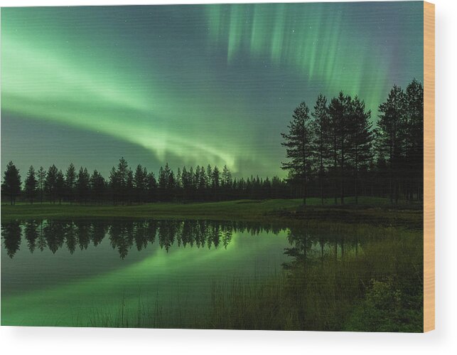 Aurora Borealis Wood Print featuring the photograph Aurora borealis above a pond by Thomas Kast