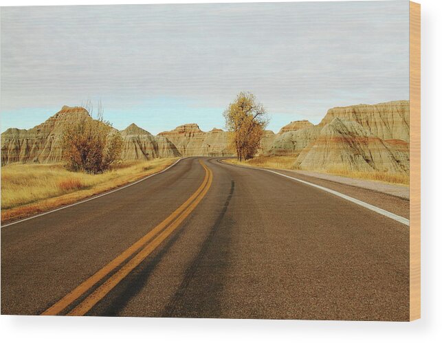 Badlands National Park Wood Print featuring the photograph Badland Blacktop by Lens Art Photography By Larry Trager