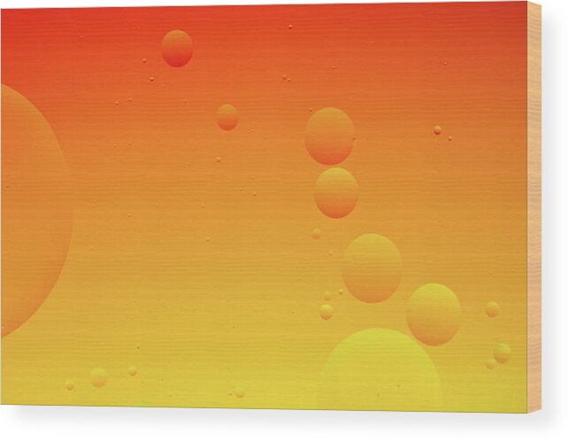 Connection Wood Print featuring the photograph Bright abstract, yellow and orange background with flying bubbles by Michalakis Ppalis