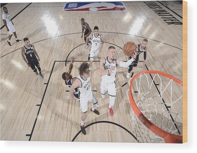 Nba Pro Basketball Wood Print featuring the photograph Brooklyn Nets v Milwaukee Bucks by David Dow