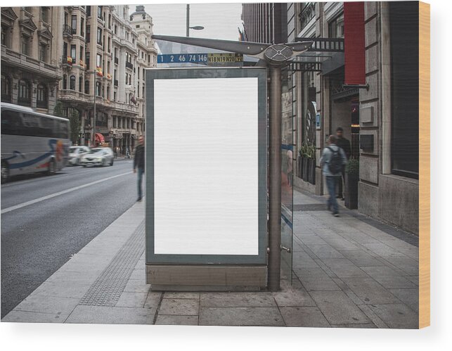 Empty Wood Print featuring the photograph Bus stop with billboard by Photography taken by Mario Gutiérrez.