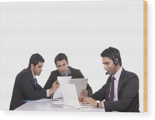 Young Men Wood Print featuring the photograph Businessmen in a meeting by Sudipta Halder