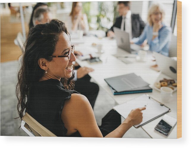 People Wood Print featuring the photograph Candid Close-Up of Hispanic Businesswoman in Office Meeting by AzmanL