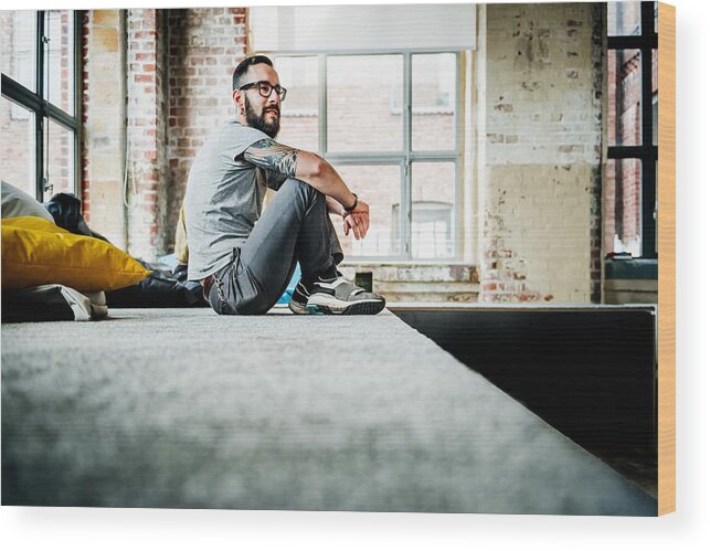 New Business Wood Print featuring the photograph Casual business person sitting in office loft by Hinterhaus Productions