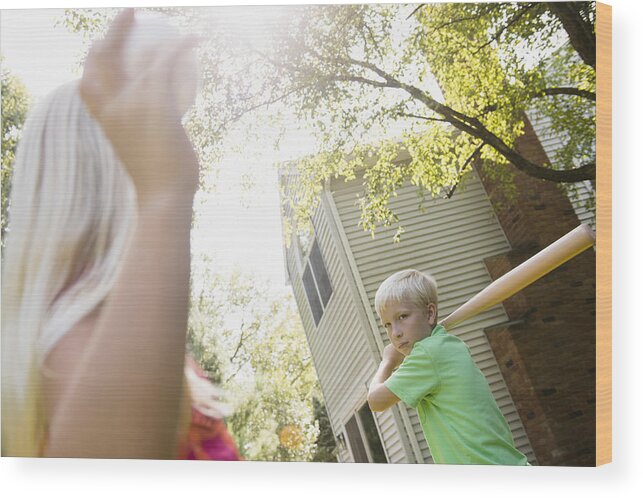 Child Wood Print featuring the photograph Caucasian children playing baseball in backyard by JGI/Jamie Grill