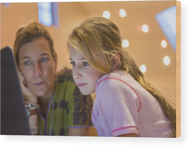 Internet Wood Print featuring the photograph Caucasian mother and daughter using computer together by Marc Romanelli