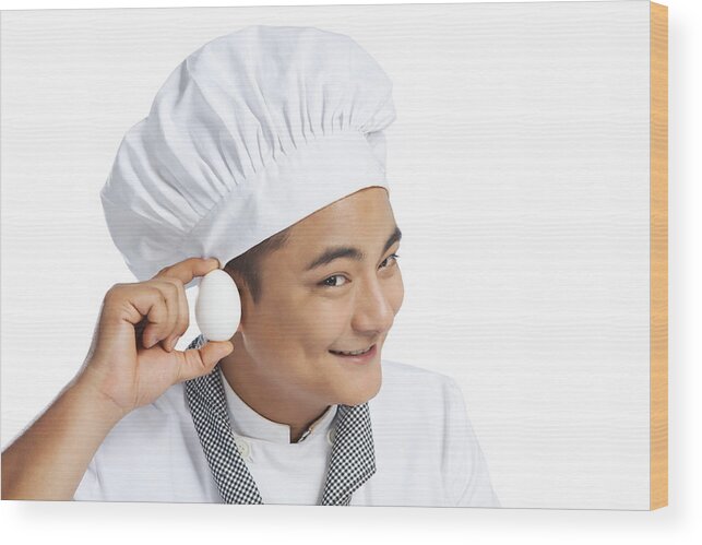 Young Men Wood Print featuring the photograph Chef listening to an egg by Ravi Ranjan