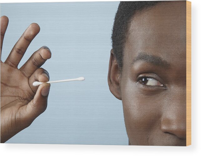 Cotton Swab Wood Print featuring the photograph Close Up Young Man Holding Cotton Bud by Emma Innocenti
