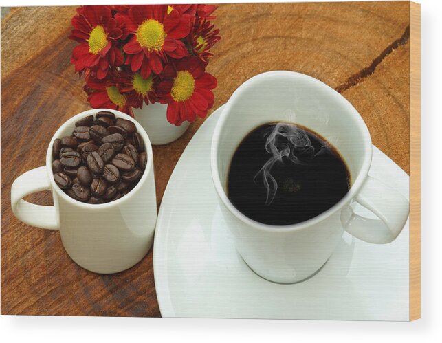 Stained Wood Print featuring the photograph Coffee cup and beans on a wood background. by Noppharat05081977