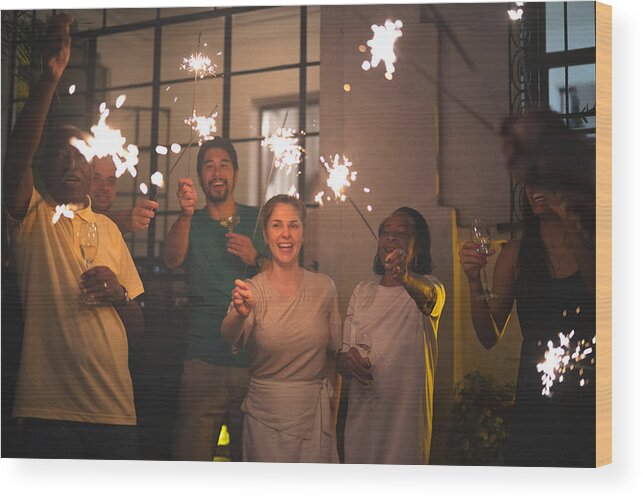 2019 Wood Print featuring the photograph Family and Friends Celebrating New Year Party with Sparkler at Home by FG Trade
