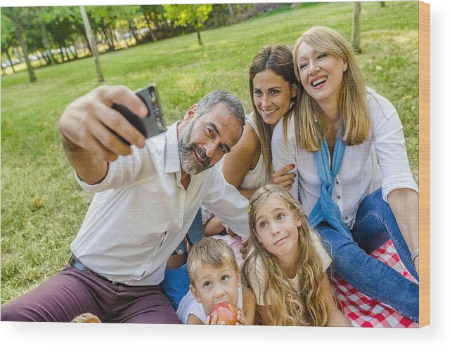 Mature Adult Wood Print featuring the photograph Family time wouldn't be complete without a selfie by Ljubaphoto