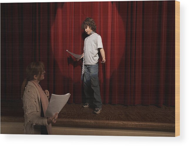 Mature Women Wood Print featuring the photograph Female teacher and boy (10-12) standing on stage rehearsing by Adam Taylor
