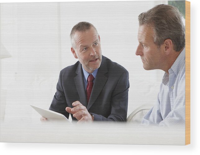 Aging Process Wood Print featuring the photograph Financial advisor talking to customer by Andrew Olney