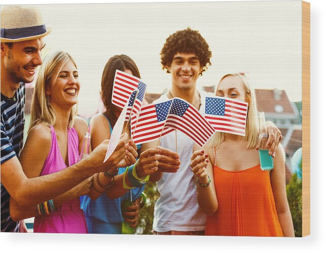 Young Men Wood Print featuring the photograph Friends celebrating Independence day by Fotostorm