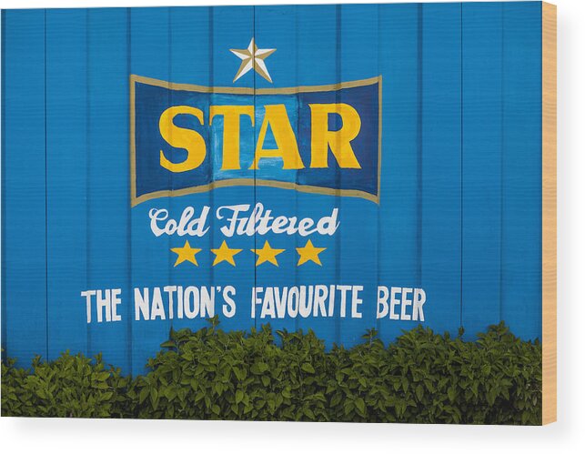 Outdoors Wood Print featuring the photograph Ghana's Star Beer freshly painted on wall by Merten Snijders