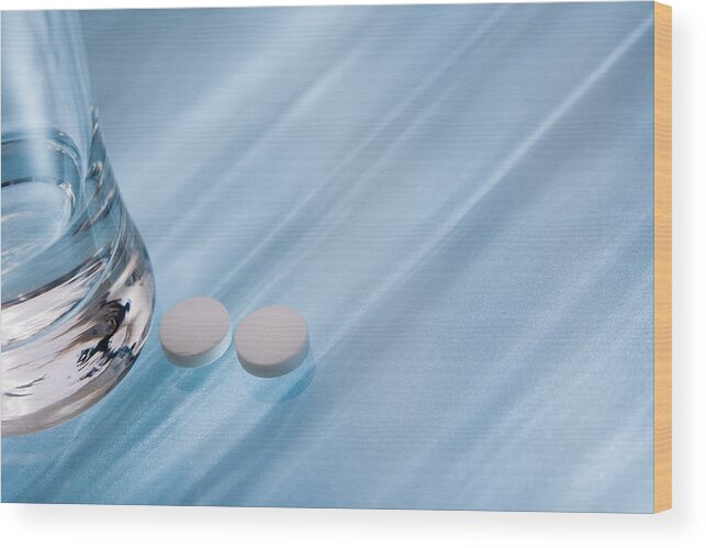 Horizontal Wood Print featuring the photograph Glass of water and pills by Comstock Images