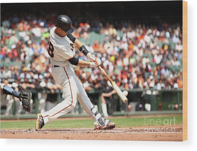 San Francisco Wood Print featuring the photograph Gorkys Hernandez and Buster Posey by Ezra Shaw