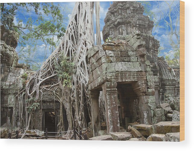 Angkor Wood Print featuring the photograph Huge tree roots engulf the ruined temple by Steve Estvanik