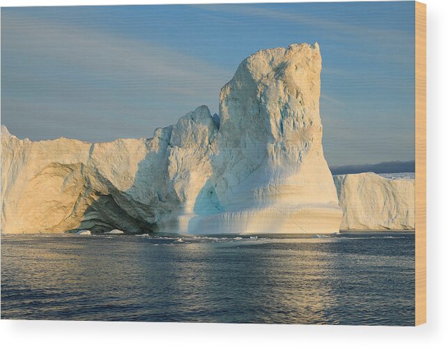 Scenics Wood Print featuring the photograph Icebergs in the Icefjord in the warm light of the midnight sun by Rainer Grosskopf