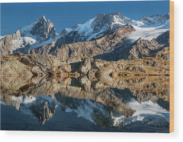 Lake Wood Print featuring the photograph La Meije peak mirrored in Lake Lerie by Olivier Parent